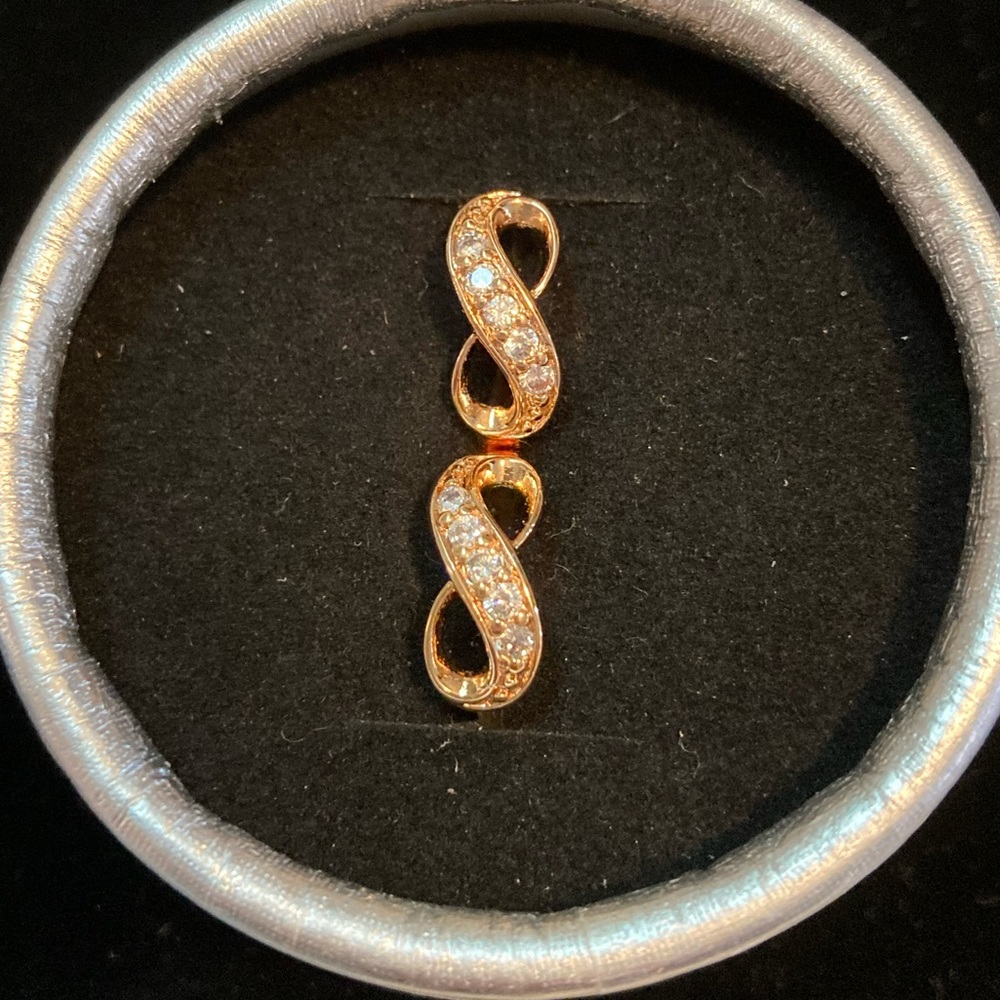 Gold plated Infinity symbol Huggies with 5 Swarovski clear stones